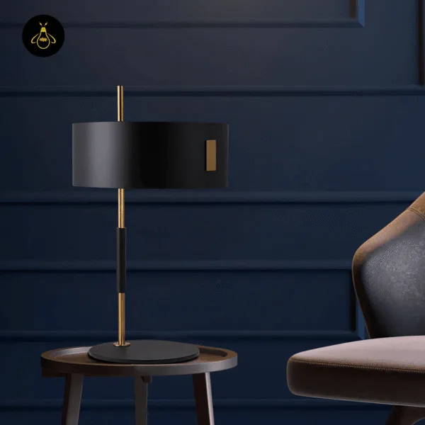Mid-century black gold table lamp on a side table beside a reading chair