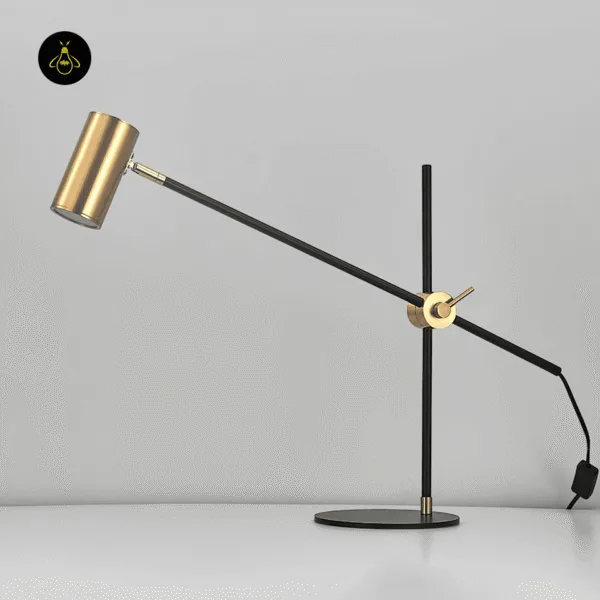 Brass desk lamp with counterbalanced arm and inline on-off switch on the cord