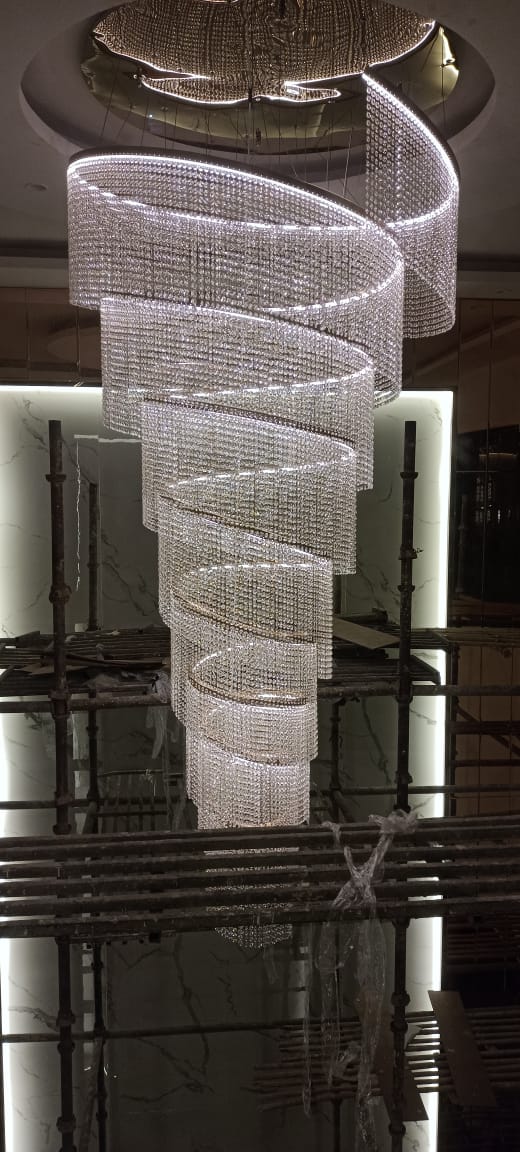 Energy-efficient LED chandelier in SKA Divya Towers common area