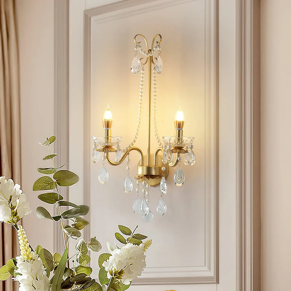 Gold Crystal Wall Sconce – 2-Light Pearl Chain French Sconce, 64 cm 6 French-design gold crystal wall sconce on a panelled wall with floral styling