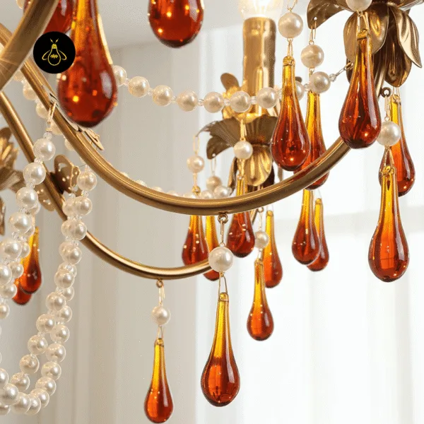Amber borosilicate glass teardrop crystals and gold arms of the amber crystal chandelier