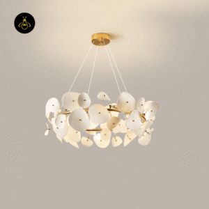 Ceramic lotus petal chandelier close-up showing gold centre studs on a brushed-brass ring