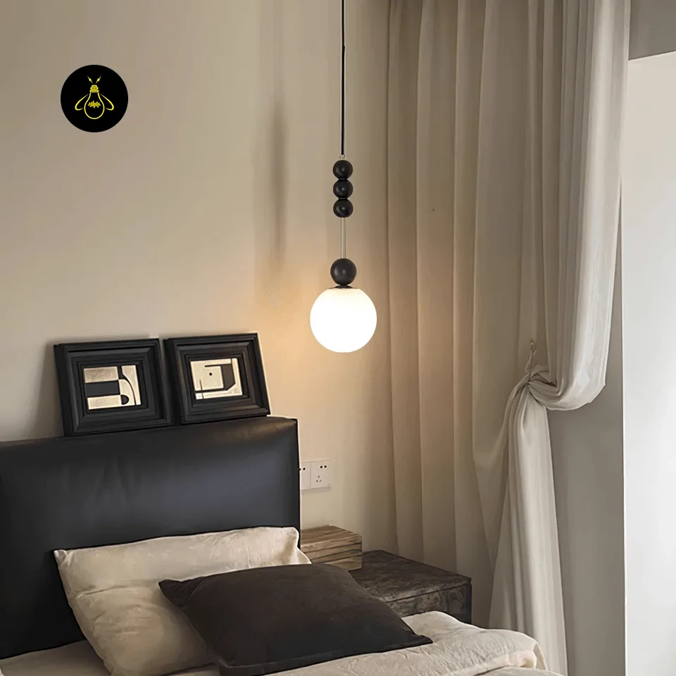 Glass Globe Pendant Light – Bola 15 cm Opal Bedside Pendant, E27 4 Bedside glass globe pendant light with black beads hanging above a bedroom nightstand