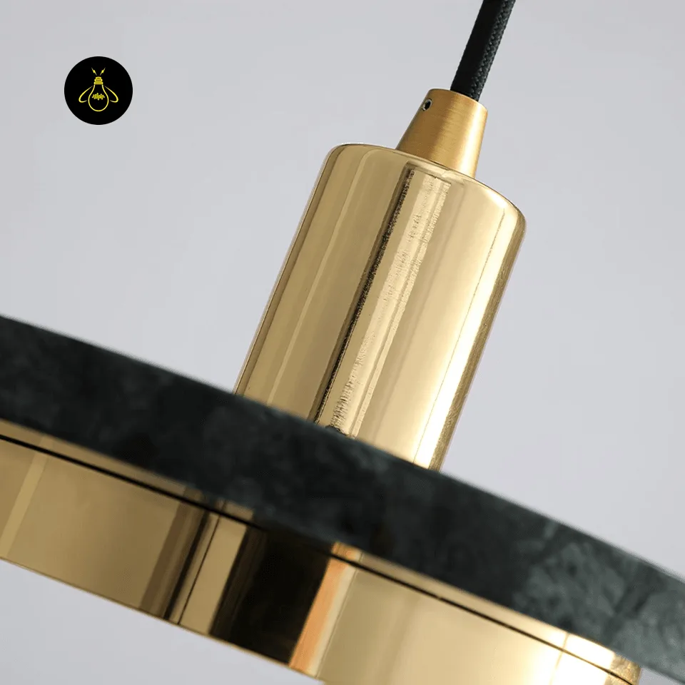 Black Marble Pendant Light – Double Circle Gold LED Drum, 20 cm 6 Close-up of the gold stainless steel cord cylinder and polished black marble edge of the black marble pendant light