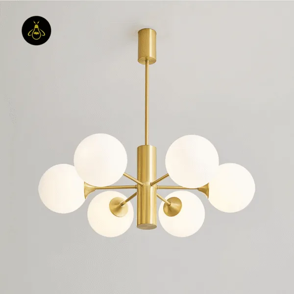Handcrafted brass arms and opal globe shades of the modern brass chandelier
