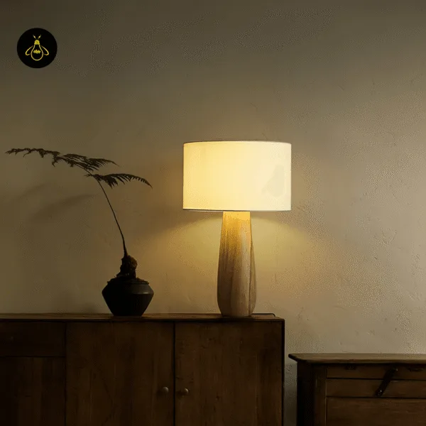 Handcrafted wooden table lamp with cream linen drum shade for bedrooms