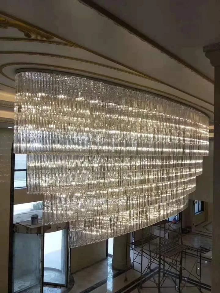 Hotel lobby chandelier side view showing elongated layered crystal curtain design