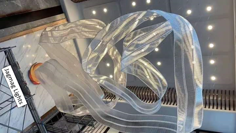 Wide view of the StayWell Kerala ribbon chandelier stretching through the hotel interior