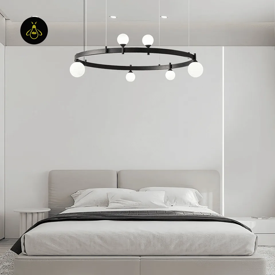 Modern Glass Chandelier – 6-Globe Black Ring, 82 cm Diameter 5 Illuminated modern glass chandelier with soft glowing opal globes above a bedroom