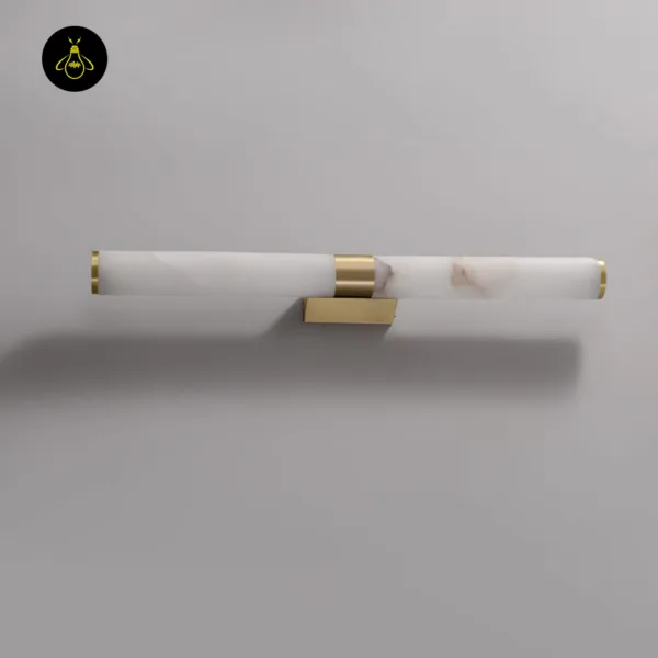 Alabaster wall light mounted horizontally on a grey wall, brushed gold centre band and backplate