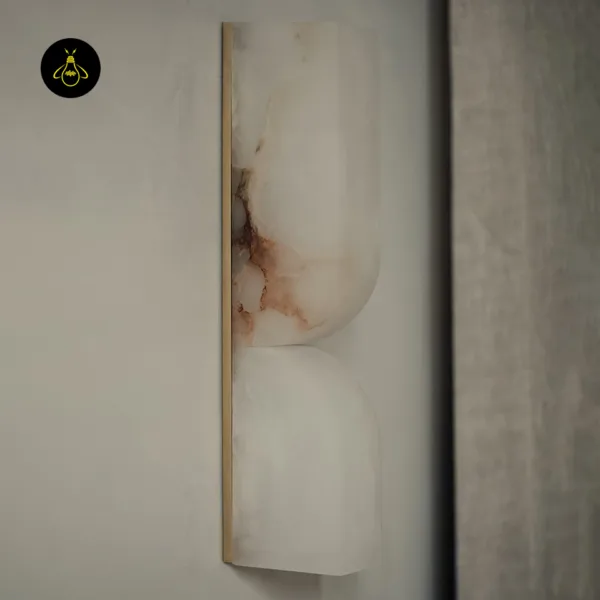 Unlit close-up of the alabaster wall light showing natural veining and gold-toned edge