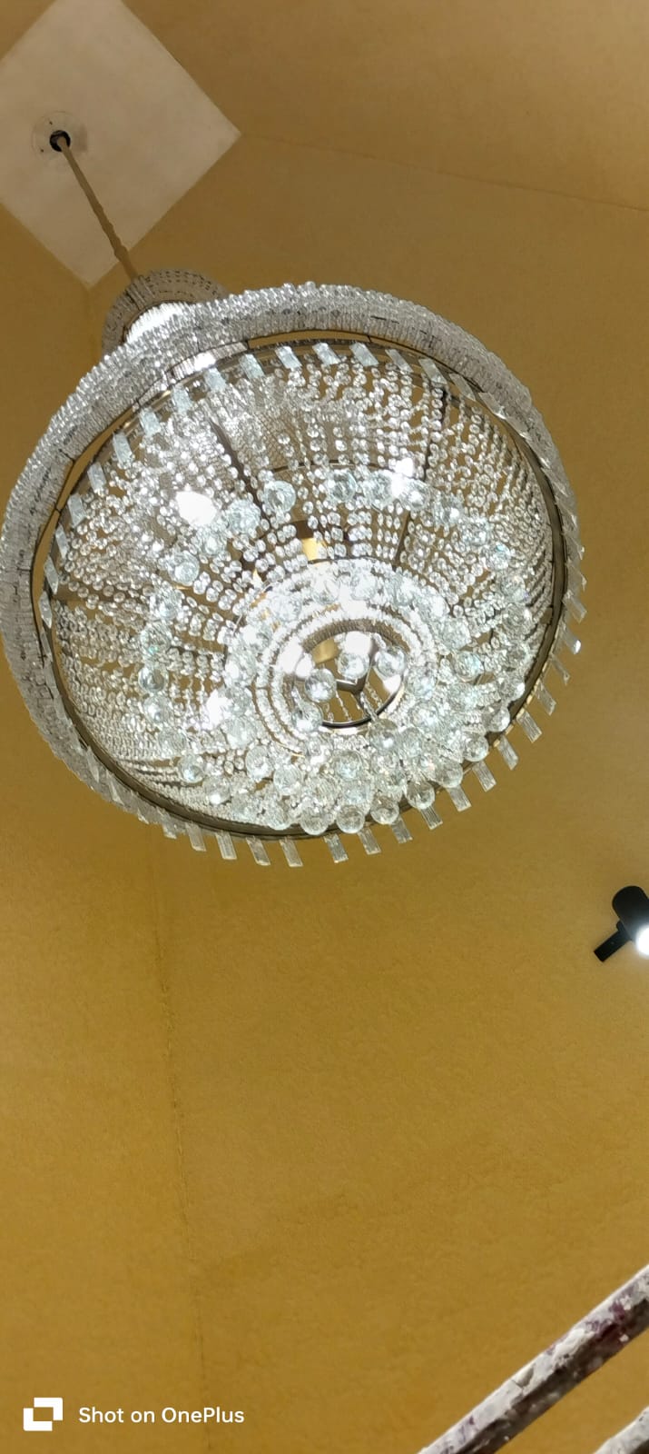 Temple chandelier installed for SKA Divya Towers prayer area