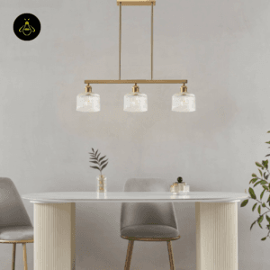 Triple glass pendant above a dining table, front view