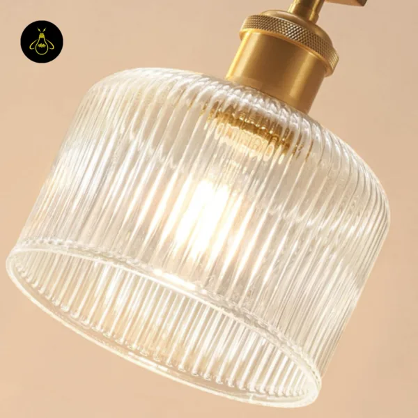 Ribbed glass chandelier detail: vertical ribs on the shade and the knurled holder