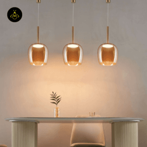 Amber glass bell pendant light over dining seating