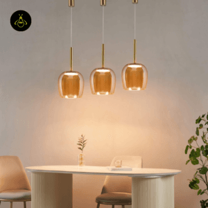 Cluster of amber glass bell pendants over dining table