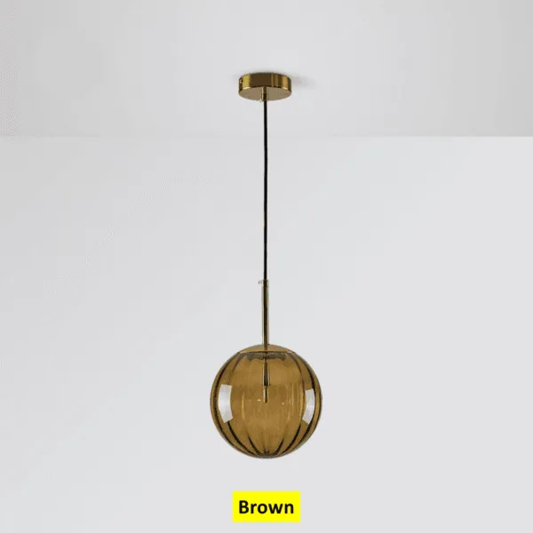 Brown globe hanging light switched off, ribbed brown borosilicate glass under a brushed gold canopy
