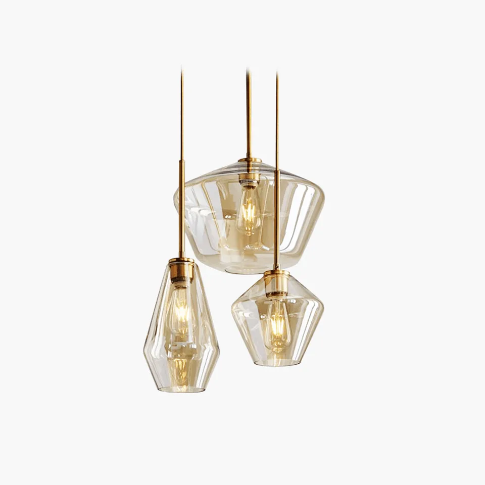 Faceted amber glass pendant light in three sizes on brass holders, front view