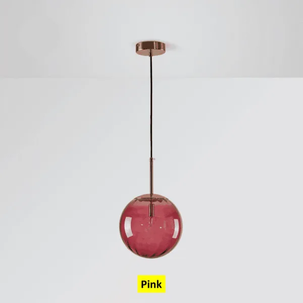 Pink globe hanging light switched off, ribbed pink borosilicate glass under the ceiling canopy