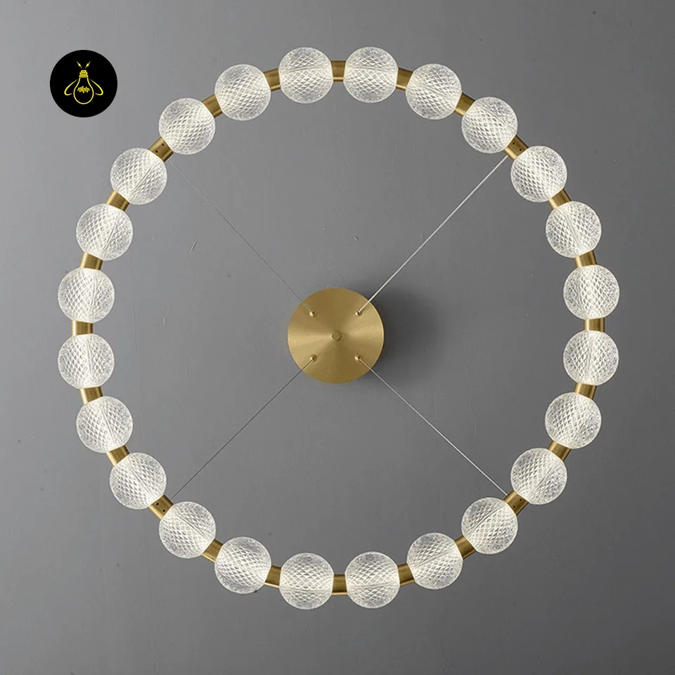Beaded Ring Chandelier – Frosted Glass Globe LED Ring (62–102 cm) 3 Beaded ring chandelier glowing above a bed with warm LED light in a modern bedroom