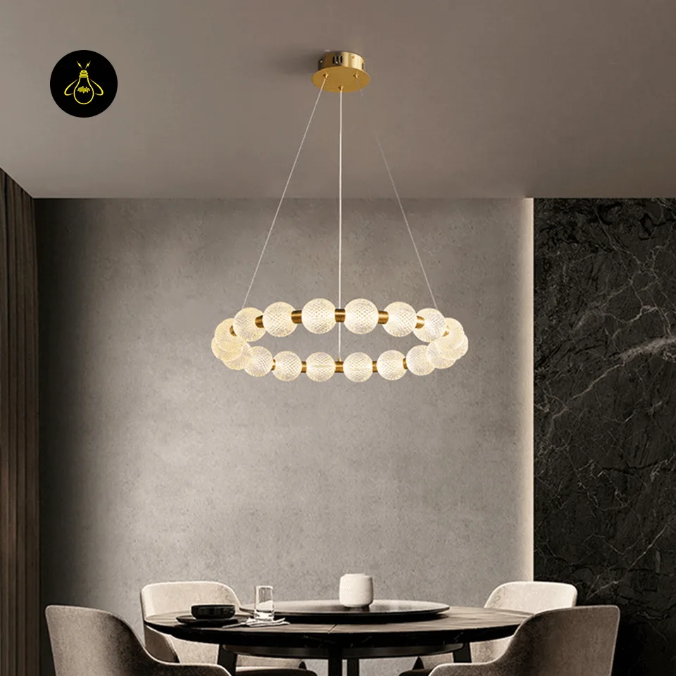 Beaded Ring Chandelier – Frosted Glass Globe LED Ring (62–102 cm) 4 Glass globe beaded ring chandelier suspended over a living room seating area