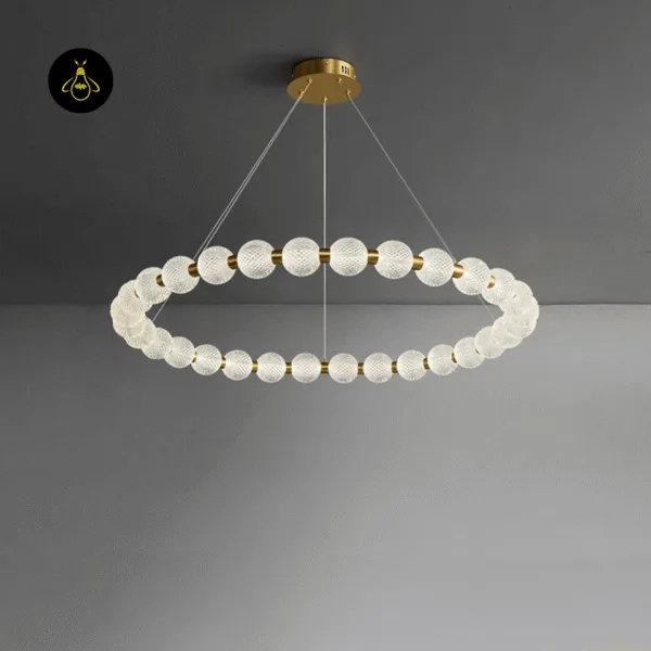 Lit beaded ring chandelier showing the warm glow from its opal borosilicate glass globes