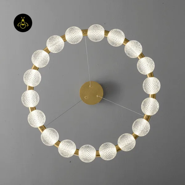 Beaded ring chandelier side view showing the 8 cm ring depth and clear hanging wires