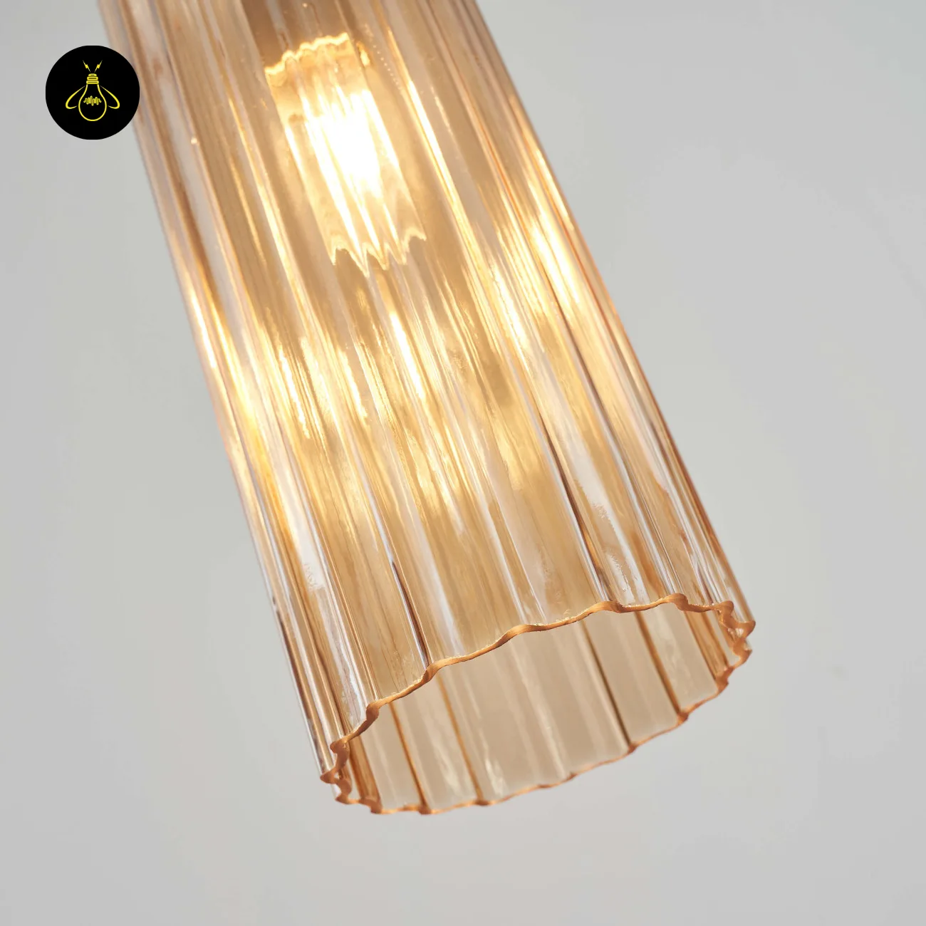 Amber Fluted Glass Pendant Light – Gold | Leonora 6 Fluted amber glass texture close-up – Leonora pendant light gold finish