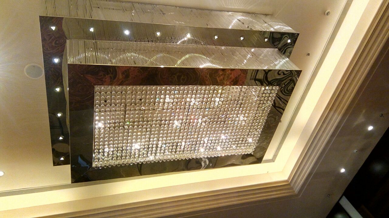 Square crystal ceiling chandelier installed in the Sarovar Portico Dehradun project
