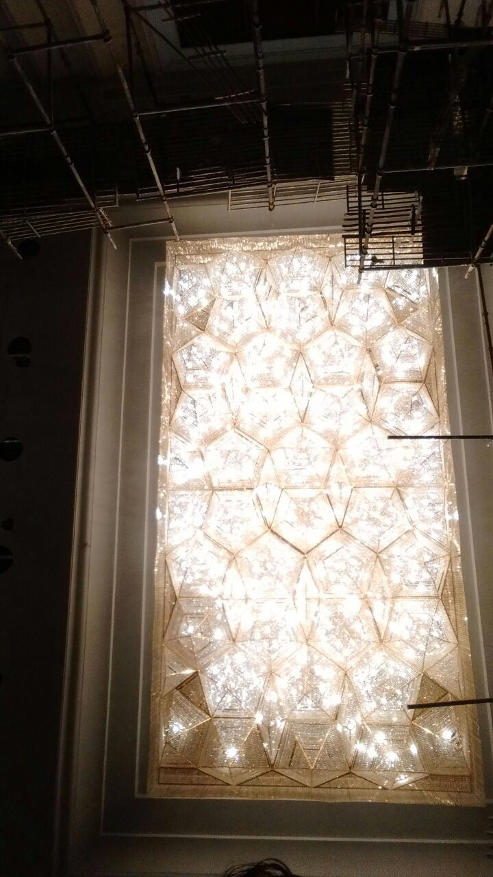 Geometric crystal ceiling installation photographed from below at Zestin Luminary Sahibabad