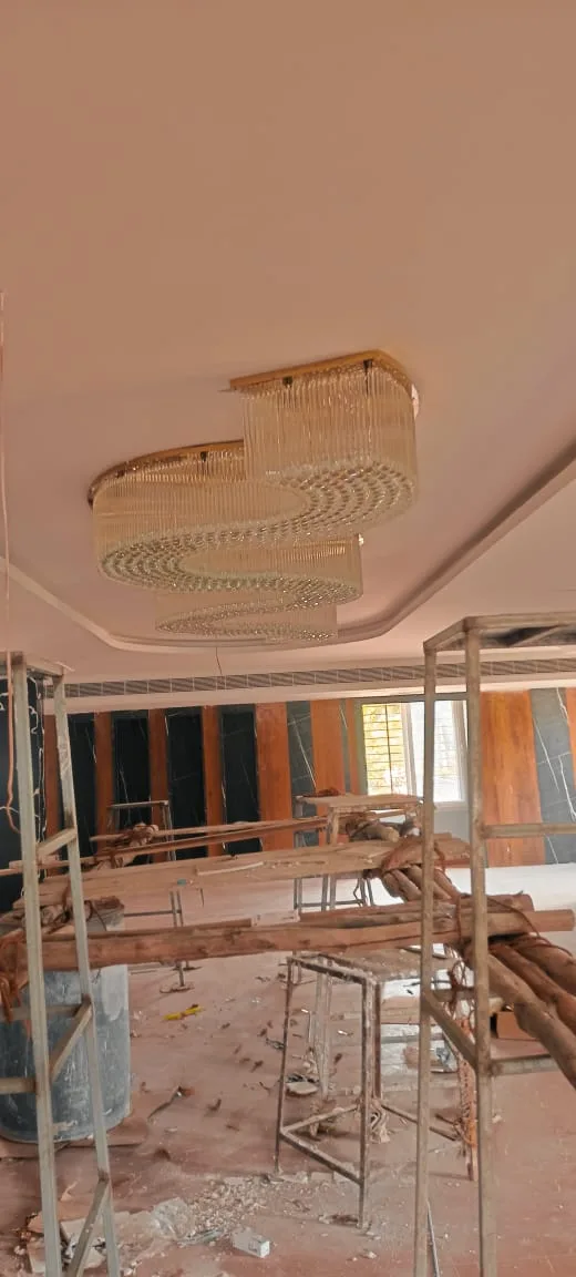 Crystal wave chandelier installation view in Visakhapatnam banquet hall