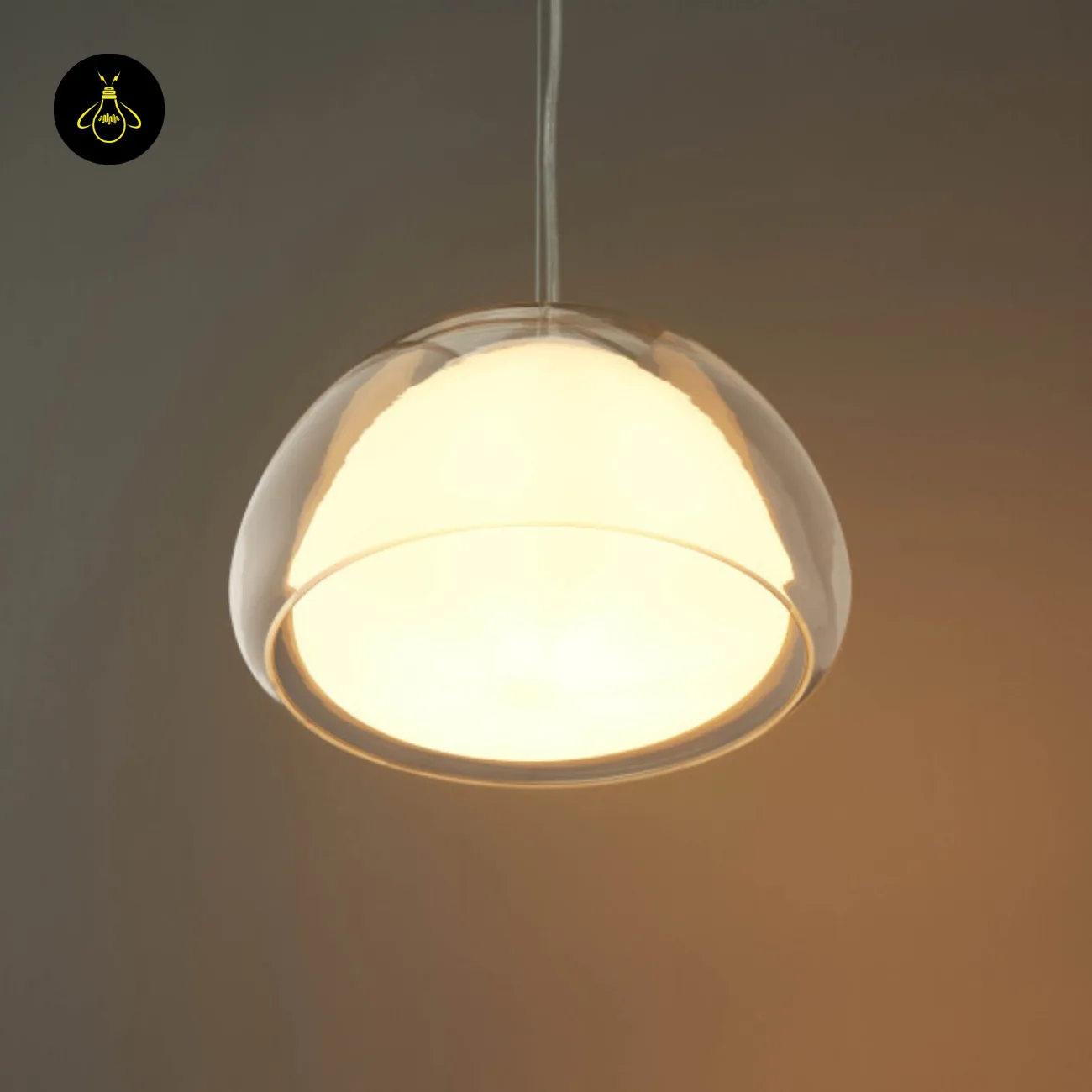 Double Glass Pendant Light – Lomelia 25 cm Dome, Gold Finish 6 Lomelia double glass pendant light seen from below, opal borosilicate inner shade glowing within the clear outer rim