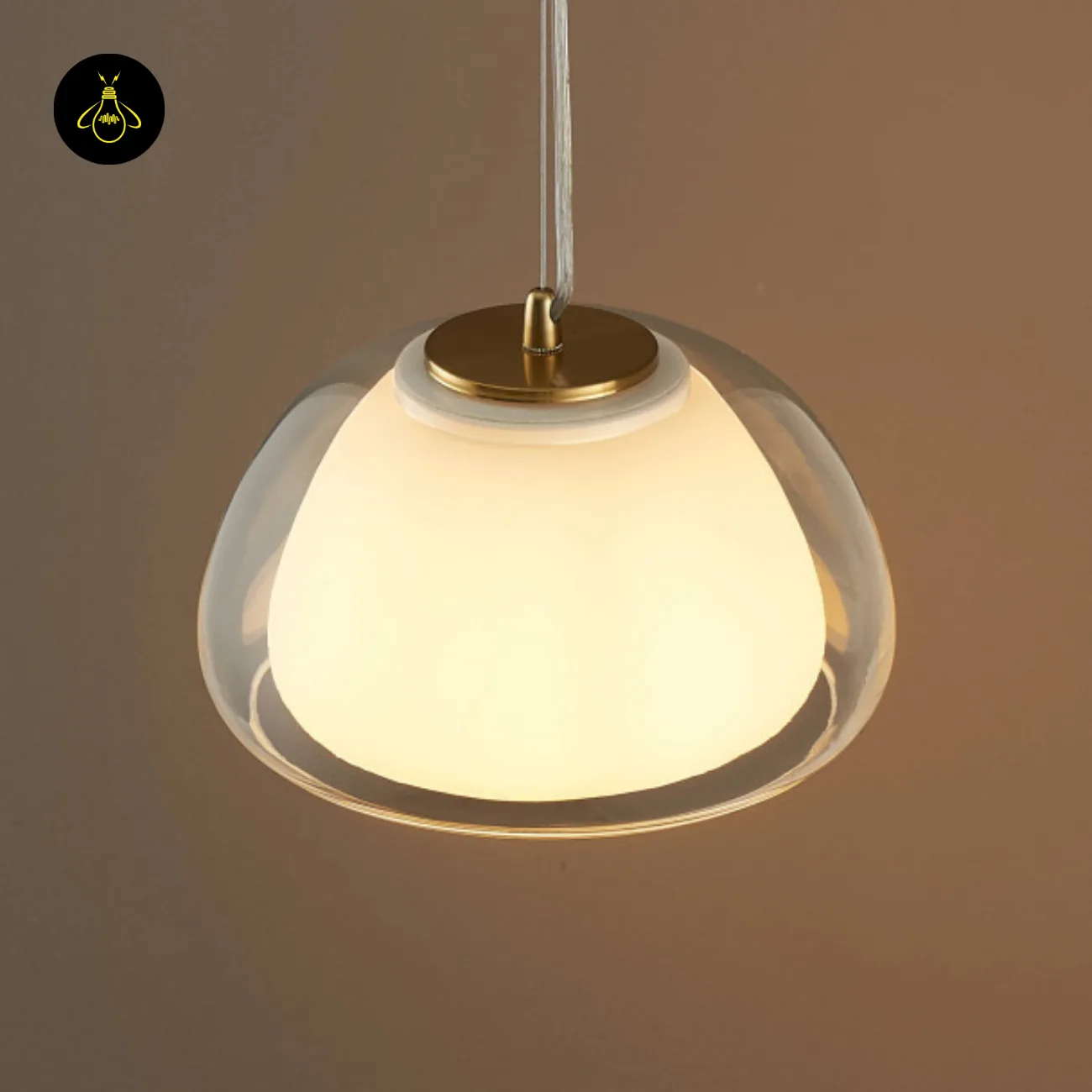 Double Glass Pendant Light – Lomelia 25 cm Dome, Gold Finish 5 Top-side view of the Lomelia double glass pendant light, gold-finish 304 stainless steel cap seated on the opal inner shade inside the clear outer dome