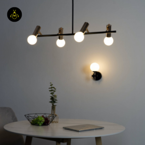 Four white opal glass globes lighting a modern dining table
