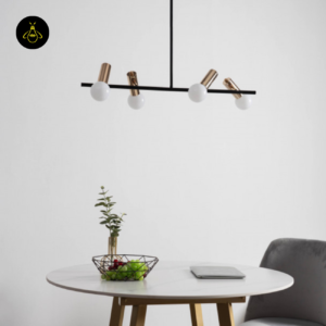 Black and gold globe pendant light over a dining table