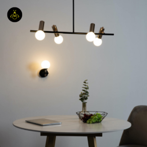 Black and gold globe pendant light in a modern dining space