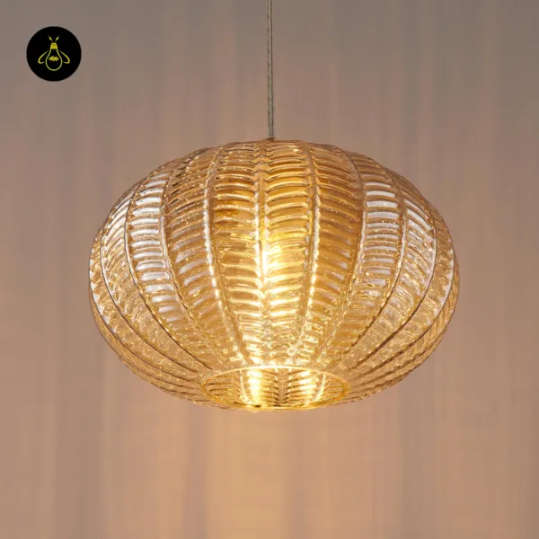 Close front view of a lit textured glass pendant light showing the ribs and open base ring