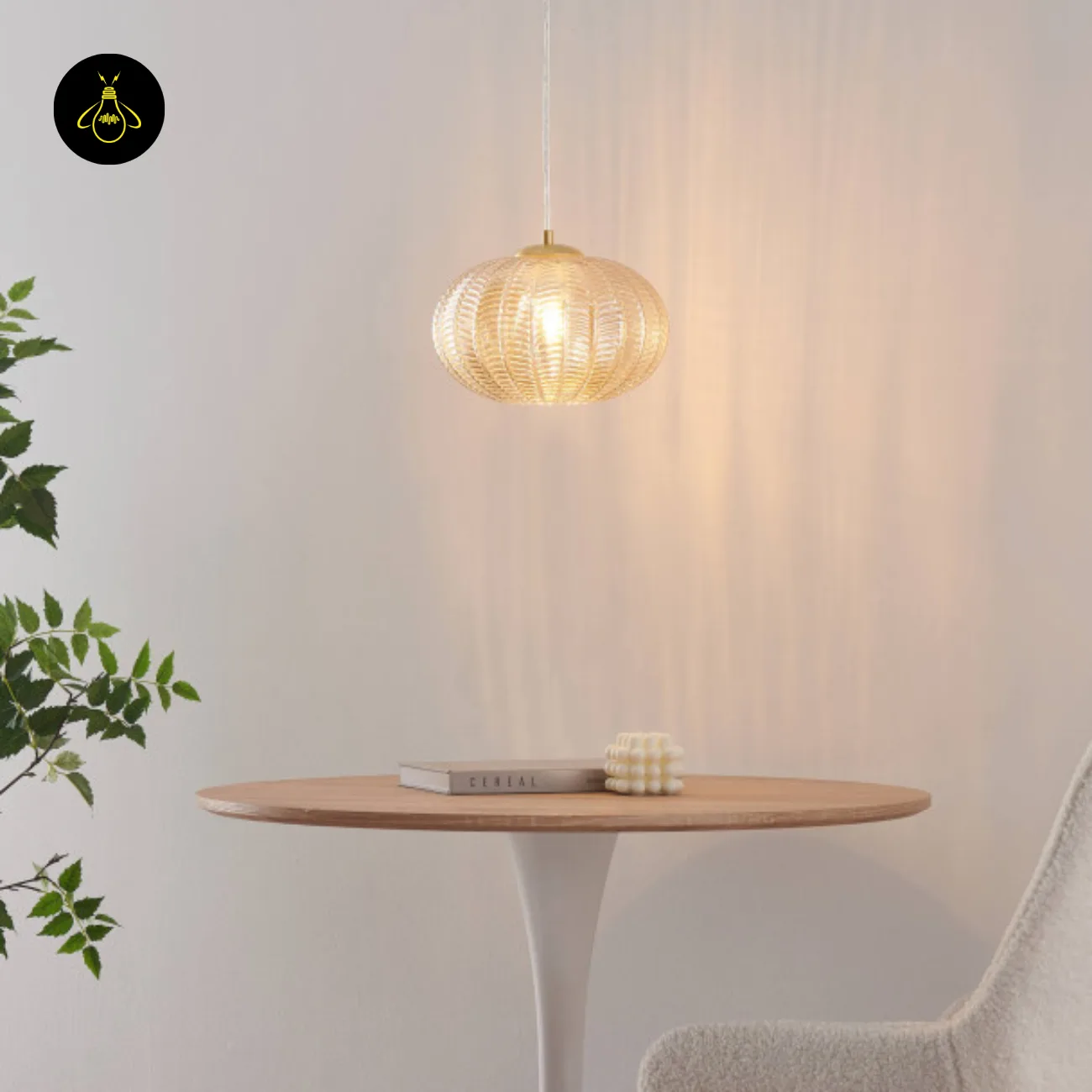 Textured Amber Glass Pendant Light – 26 cm Globe, Brass Finish, E27 5 Amber textured glass pendant light glowing over a round wooden table with a book and candle
