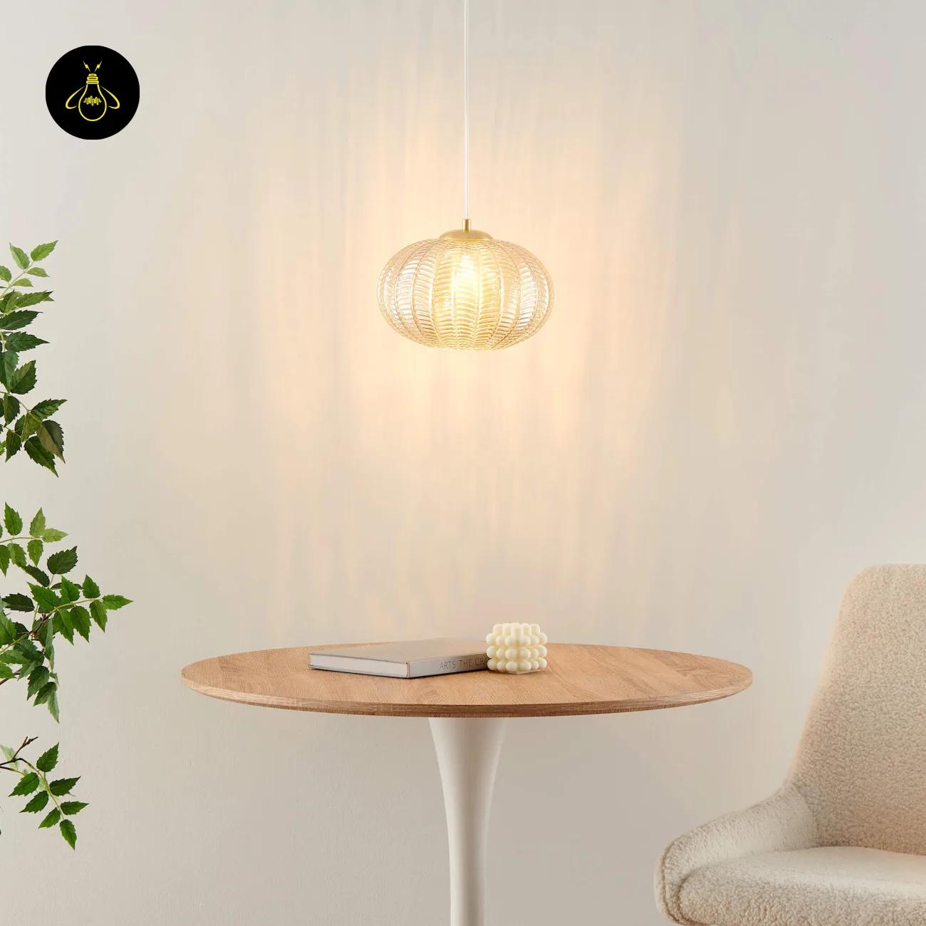 Textured Amber Glass Pendant Light – 26 cm Globe, Brass Finish, E27 4 Textured glass pendant light over a round wooden table beside a cream chair and a green plant