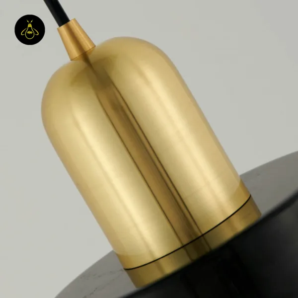 Brushed gold 304 stainless steel cap of the marble hanging light on its black cord