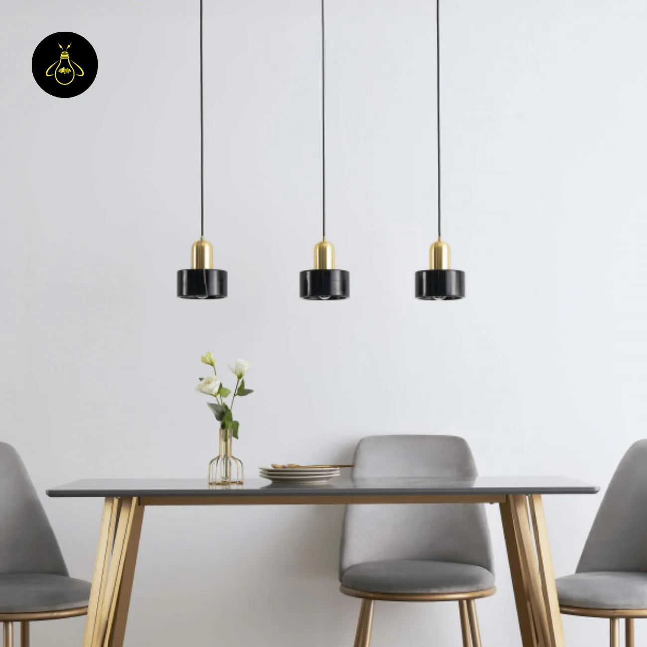 Black Marble Pendant Light – Meryl | 15 cm Marble Hanging Light with Gold Cap 8 Row of three marble hanging lights above a dining table and grey chairs