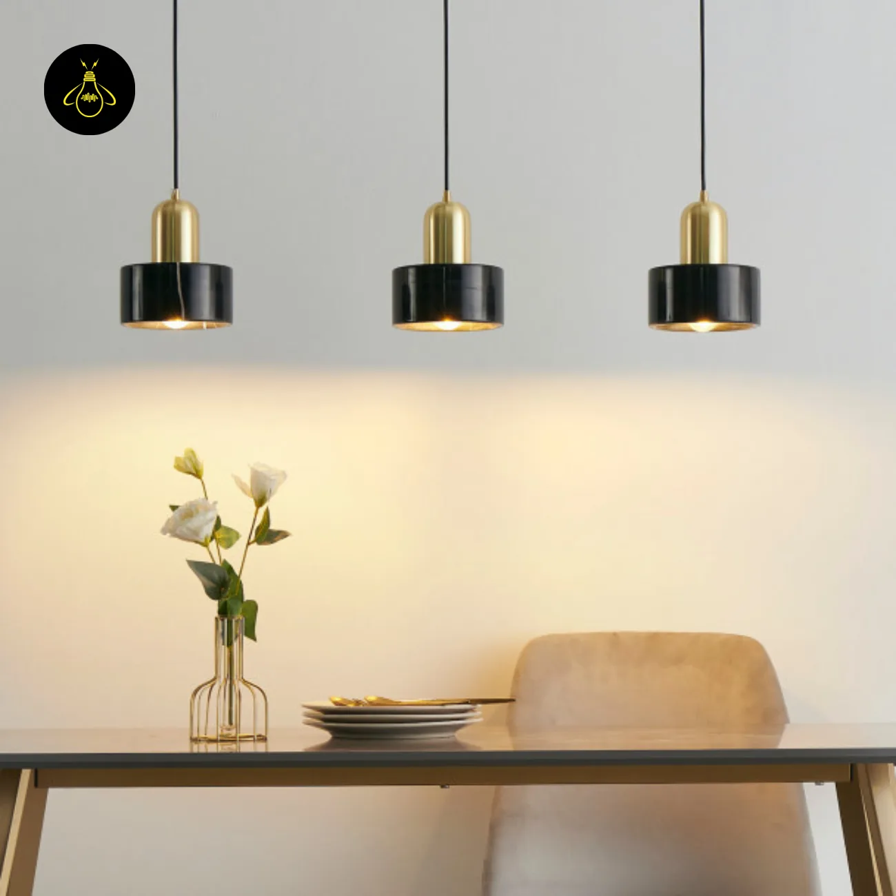 Black Marble Pendant Light – Meryl | 15 cm Marble Hanging Light with Gold Cap 11 Three marble hanging lights hung low over a dining table, warm light on the table top