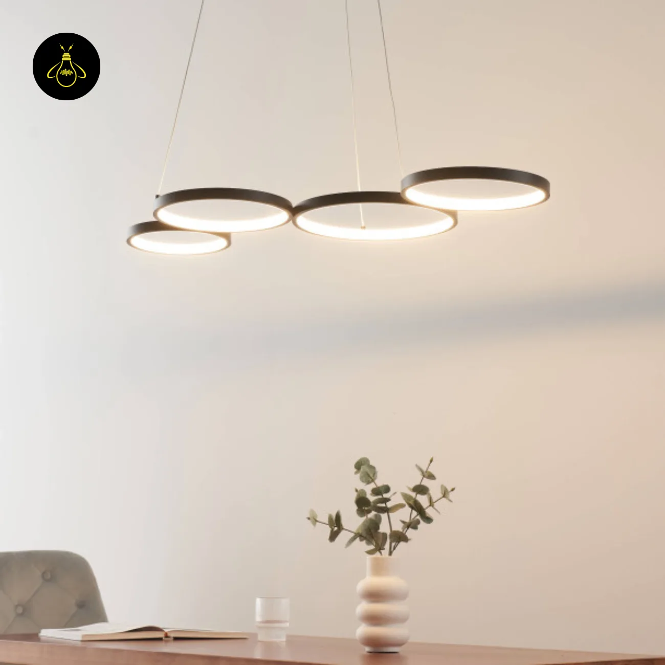 Black Ring Chandelier – Newton 4-Ring LED, 88 cm 6 Newton ring chandelier over a dining setting