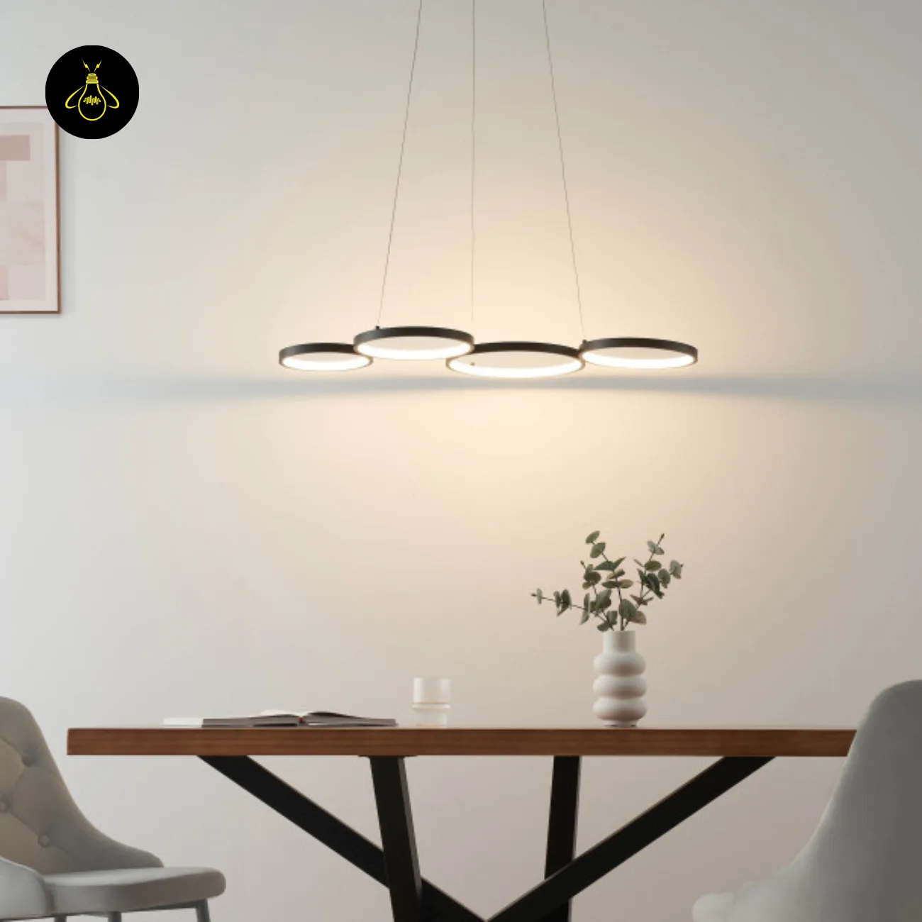 Black Ring Chandelier – Newton 4-Ring LED, 88 cm 10 Black ring chandelier installed above a dining table, front