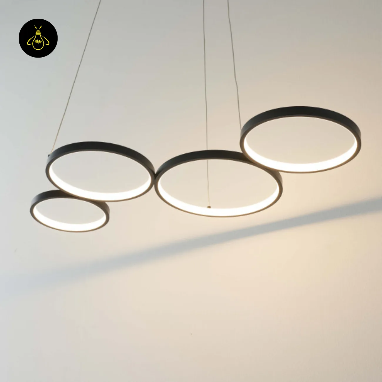 Black Ring Chandelier – Newton 4-Ring LED, 88 cm 3 Black ring chandelier side view installed in a room
