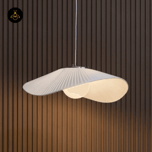 Decorative shadow pattern on wall cast by Odalia white fabric pendant