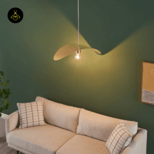 Piuma curved pendant light installed above a living room