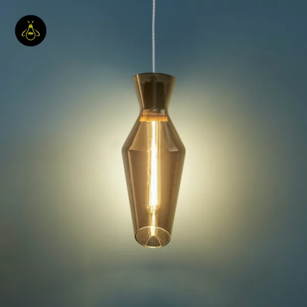 Close view of the lit faceted smoked glass pendant light, the wood holder sleeve glowing inside the neck