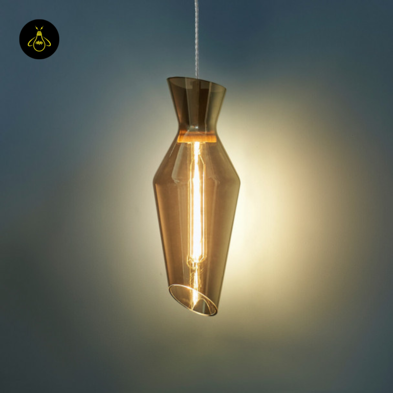 Faceted smoked glass pendant light shade detail with a warm interior glow