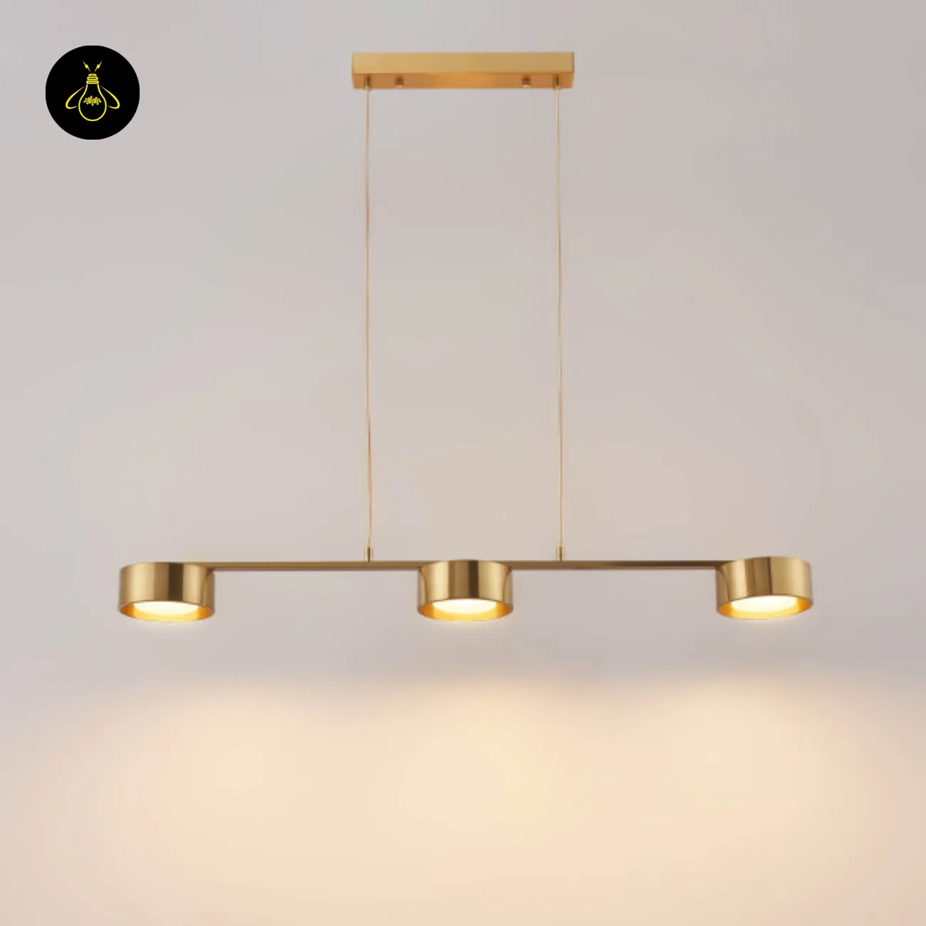 Linear Brass Chandelier – Triple Drum Spots, 108 cm | Jagmag Lights 2 Brass linear chandelier with three integrated-LED drum spots hanging against white – Jagmag Lights